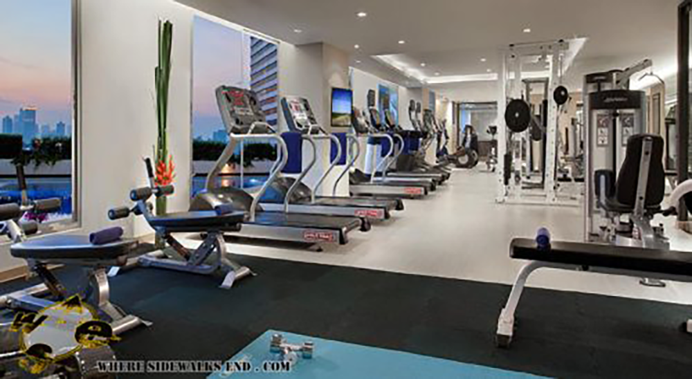 Fitness centre and gym, overlooking the outdoor pool! at Somerset Lake Point Hotel in Bangkok for Digital Nomads