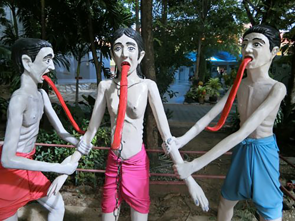 Scenes in Buddhist hell at Thailand's Wat Muang