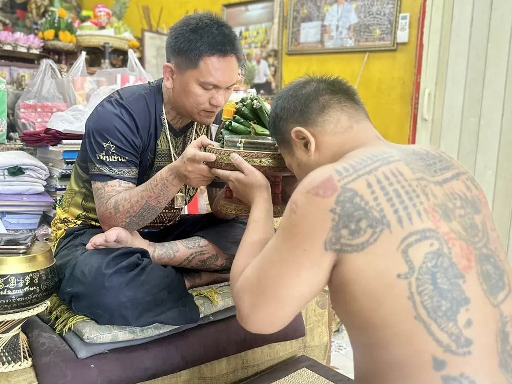 An offering ceremony with Ajarn Yod before a sak yant in Phuket