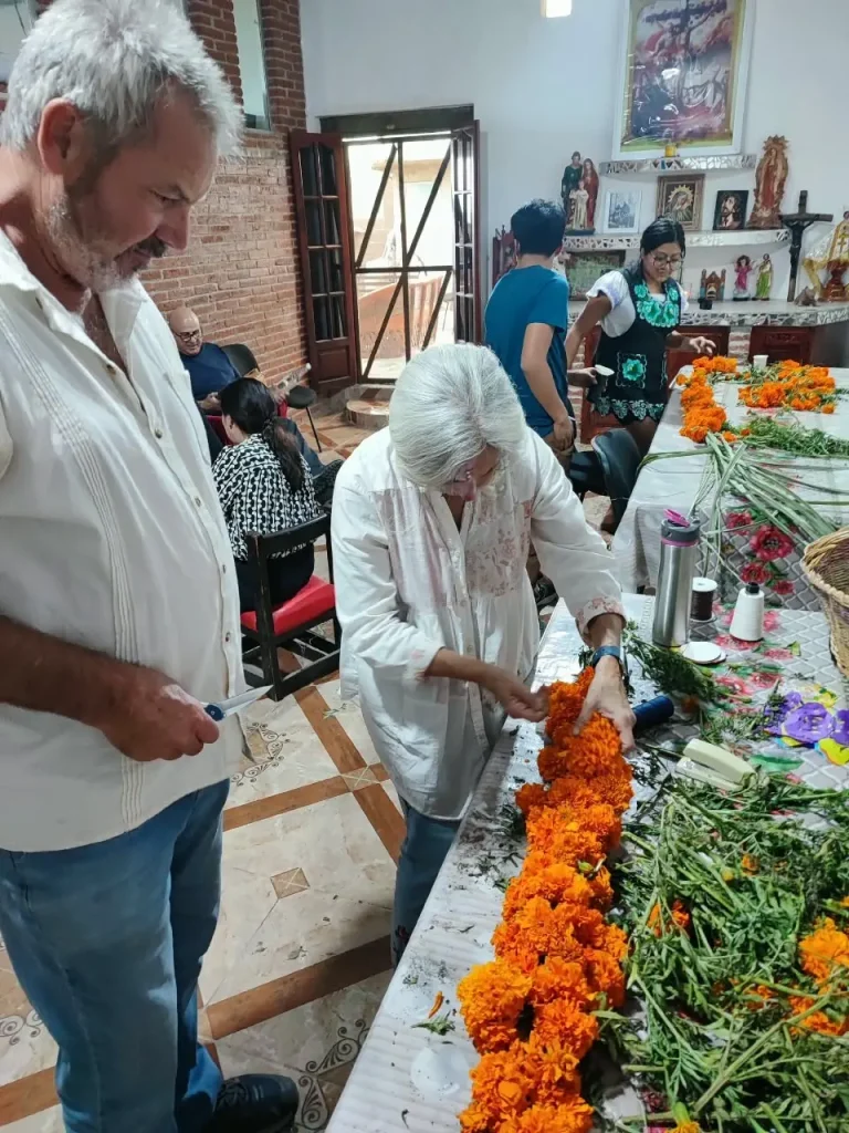 Oaxaca Day of the Dead - Teotitlan del Valle - Small group tour - teotitlan choosing marigolds for altars
