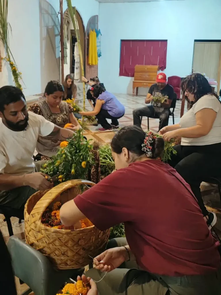 Oaxaca Day of the Dead - Teotitlan del Valle - Small group tour -teotitlan group effort building an altar